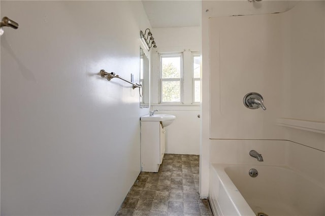 bathroom featuring shower / tub combination and vanity