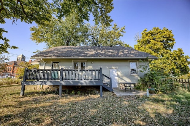 rear view of property with a deck