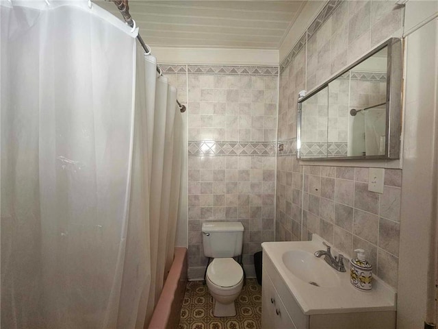 full bathroom with vanity, toilet, tile walls, and crown molding