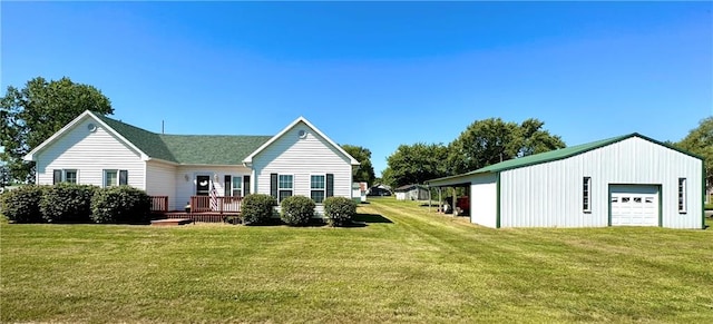 back of property with a garage, a wooden deck, and a lawn