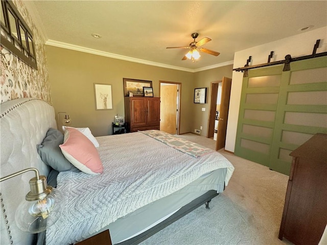 bedroom with light carpet, ceiling fan, crown molding, and a barn door