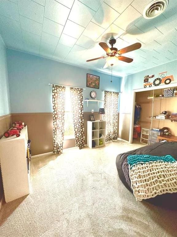 bedroom featuring ceiling fan and carpet flooring