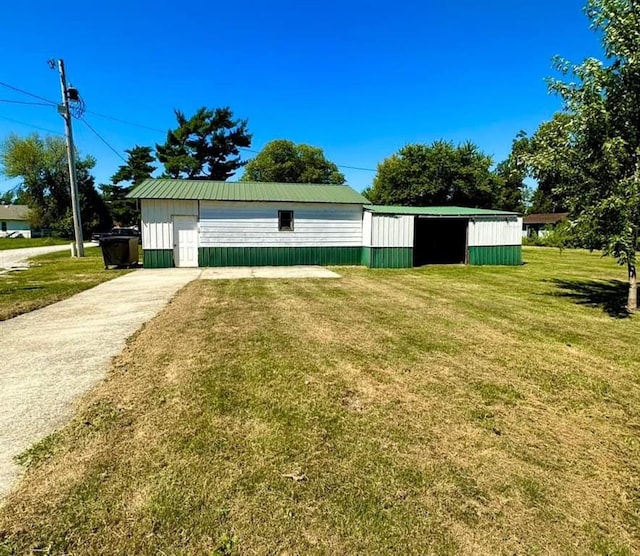 exterior space with a lawn and an outdoor structure