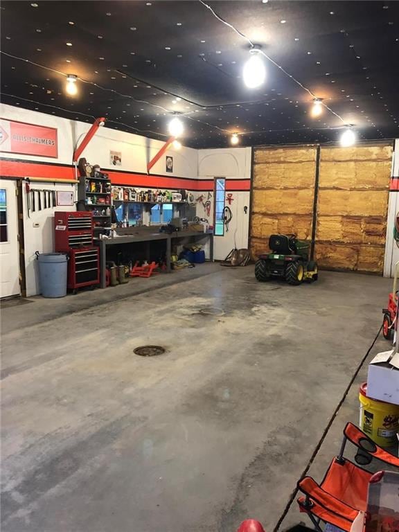 garage with a workshop area