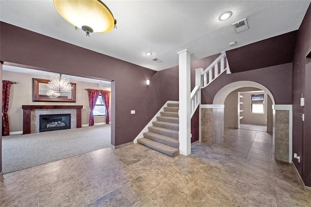 interior space with a tiled fireplace