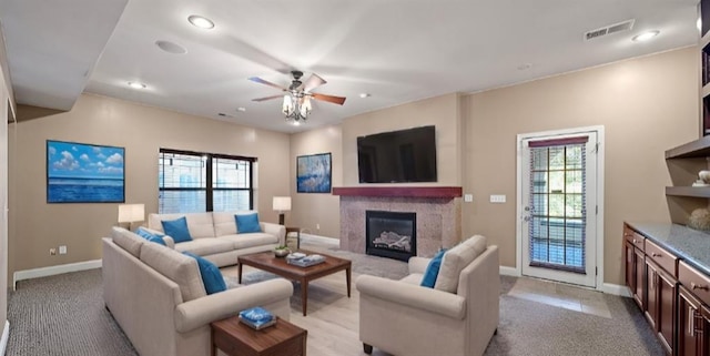 carpeted living room featuring a healthy amount of sunlight and ceiling fan