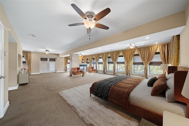 bedroom featuring french doors, ceiling fan, and carpet floors