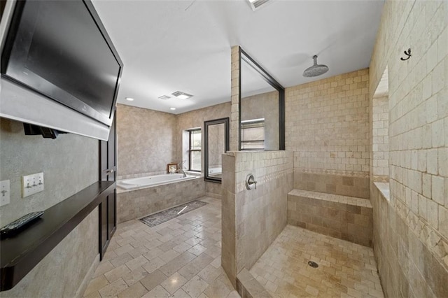 bathroom featuring separate shower and tub