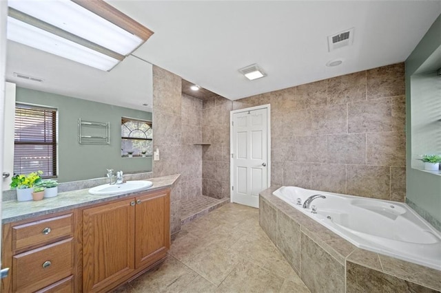 bathroom featuring vanity, tile walls, and plus walk in shower