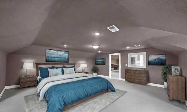 bedroom featuring vaulted ceiling and carpet flooring