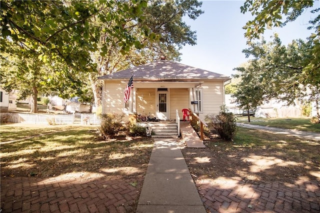 bungalow with a front yard