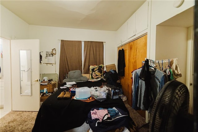 carpeted bedroom with a closet