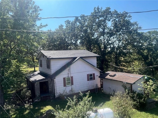 view of side of property with a yard