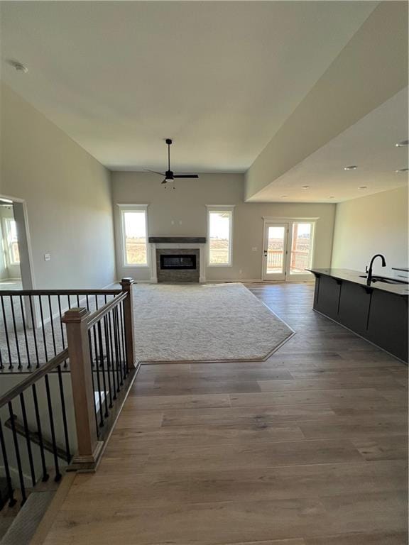 hallway featuring sink and hardwood / wood-style flooring