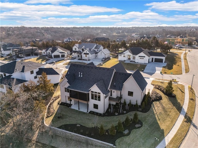 birds eye view of property with a residential view