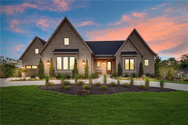 21396 W 93rd Ct, Lenexa, KS 66220 - french provincial home featuring a standing seam roof, a lawn, and metal roof