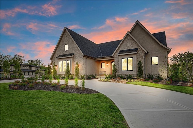 21396 W 93rd Ct, Lenexa, KS 66220 - view of front of house featuring a front yard, concrete driveway, and roof with shingles