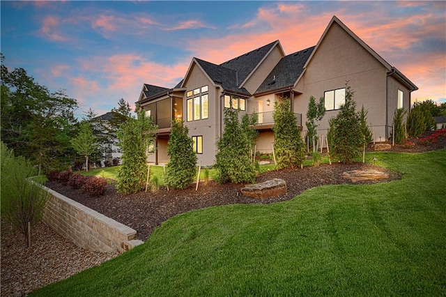21396 W 93rd Ct, Lenexa, KS 66220 - view of front of property featuring stucco siding and a yard