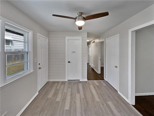 foyer featuring light wood-type flooring and ceiling fan