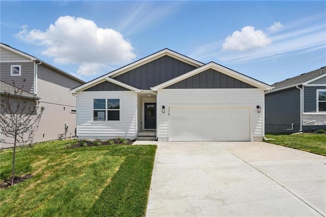 778 Creekmoor Dr, Raymore, MO 64083 - view of front of house featuring board and batten siding, an attached garage, a front yard, and concrete driveway