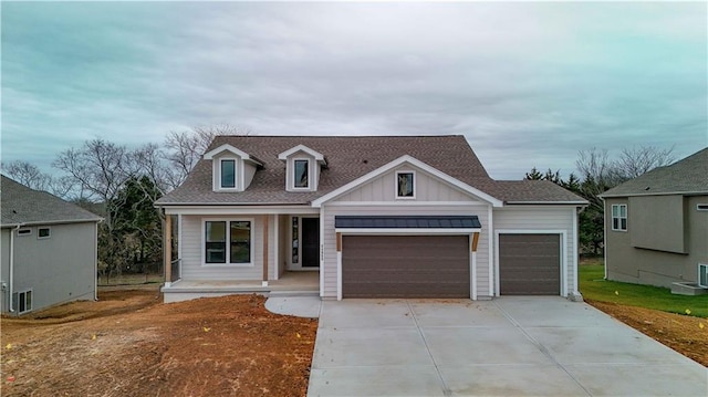 view of front of property featuring a porch and a garage