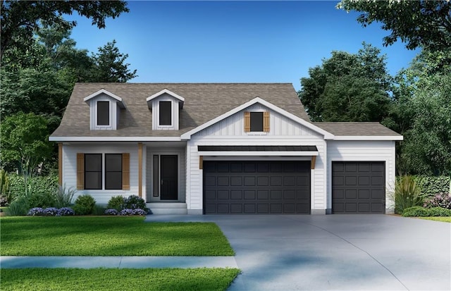 view of front facade featuring a front yard and a garage