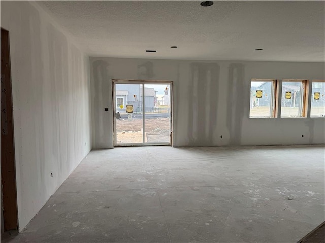 spare room featuring a textured ceiling