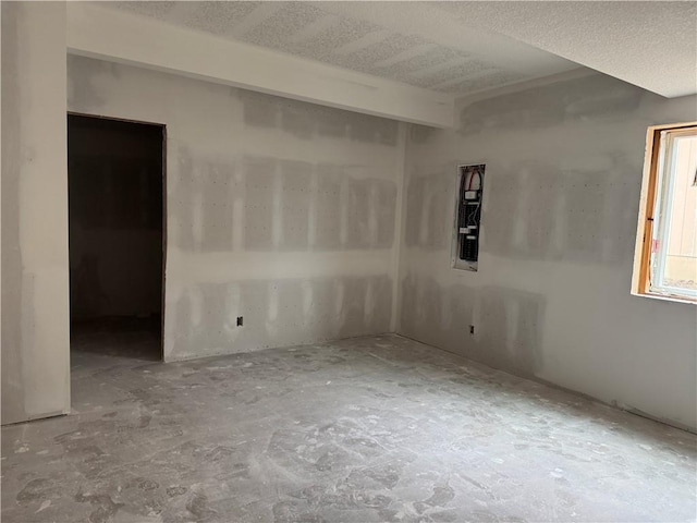 empty room featuring a textured ceiling