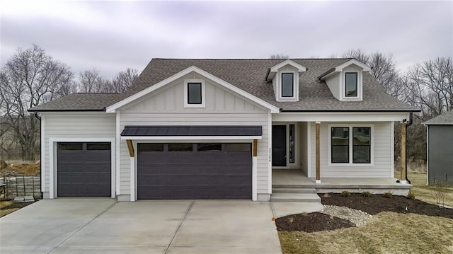 view of front facade featuring roof with shingles, a porch, board and batten siding, a garage, and driveway