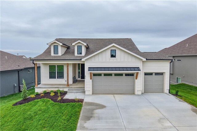 1617 SW Arbor Park Dr, Lees Summit, MO 64082 - modern inspired farmhouse featuring covered porch, driveway, a garage, board and batten siding, and a front yard