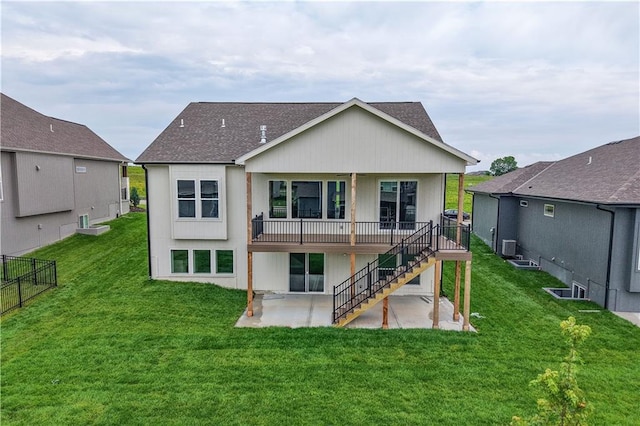 1617 SW Arbor Park Dr, Lees Summit, MO 64082 - back of property featuring a patio area, stairs, a wooden deck, and a shingled roof