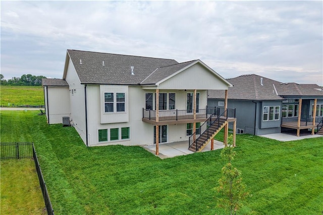 1617 SW Arbor Park Dr, Lees Summit, MO 64082 - rear view of house featuring a patio, a shingled roof, a wooden deck, and stairs