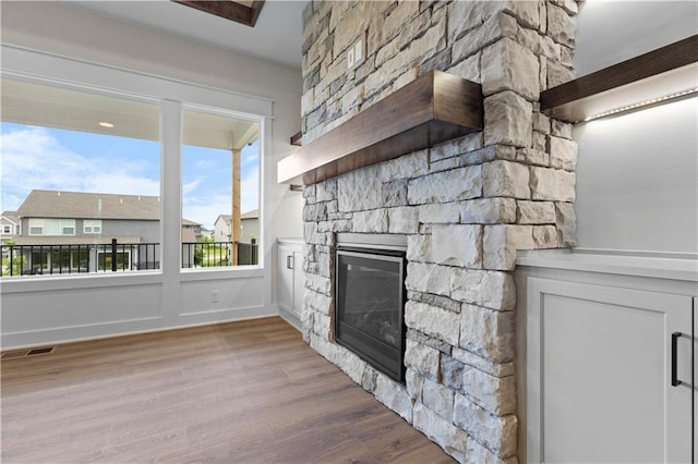1617 SW Arbor Park Dr, Lees Summit, MO 64082 - unfurnished living room featuring a fireplace and wood finished floors