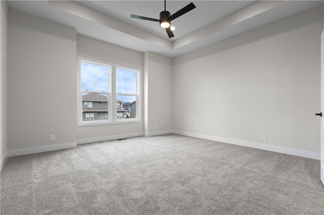 1617 SW Arbor Park Dr, Lees Summit, MO 64082 - unfurnished room featuring a tray ceiling, carpet, and a ceiling fan