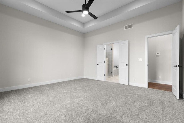 1617 SW Arbor Park Dr, Lees Summit, MO 64082 - unfurnished bedroom with carpet floors, a raised ceiling, and a ceiling fan