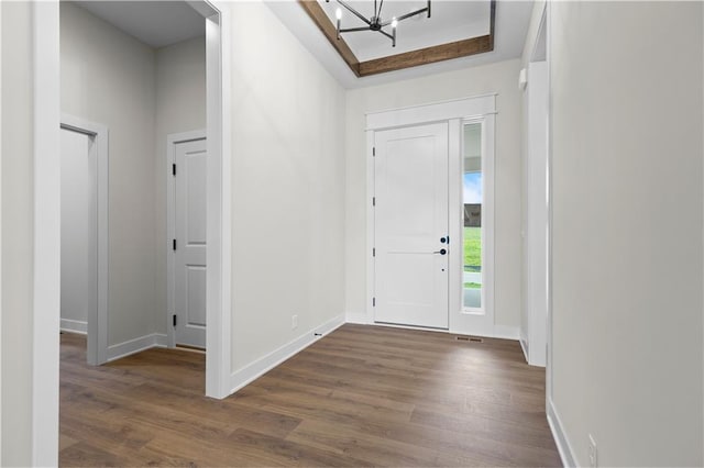 1617 SW Arbor Park Dr, Lees Summit, MO 64082 - foyer with a chandelier and dark wood-style flooring