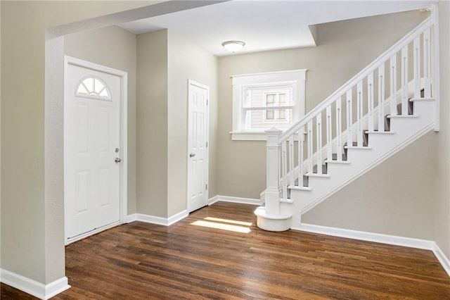 foyer with dark hardwood / wood-style floors