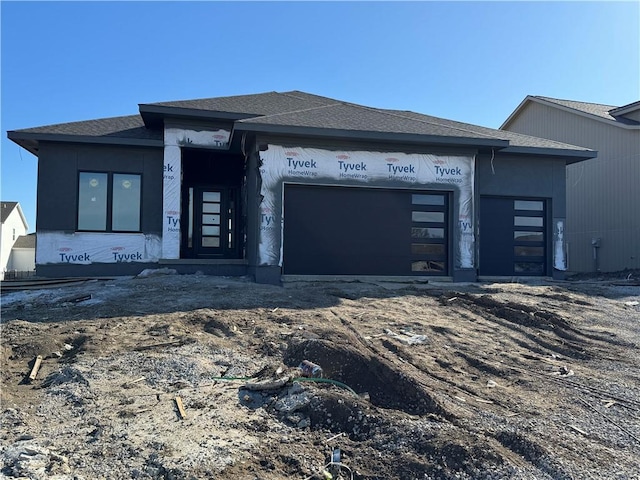 unfinished property with a garage