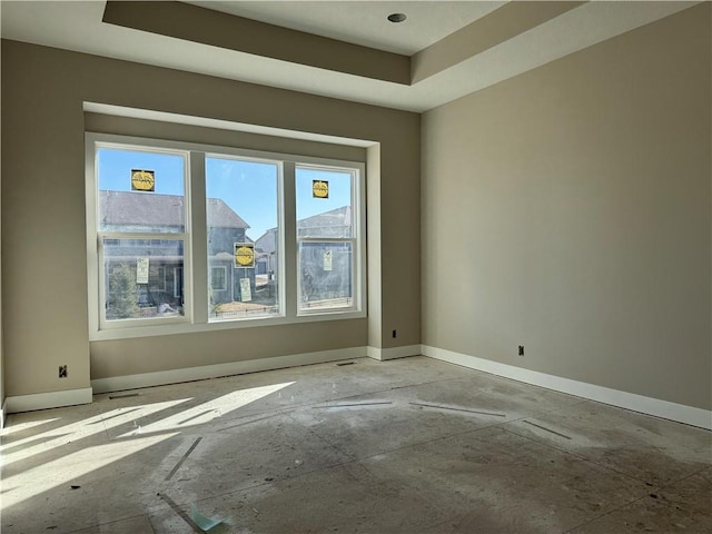 empty room featuring baseboards