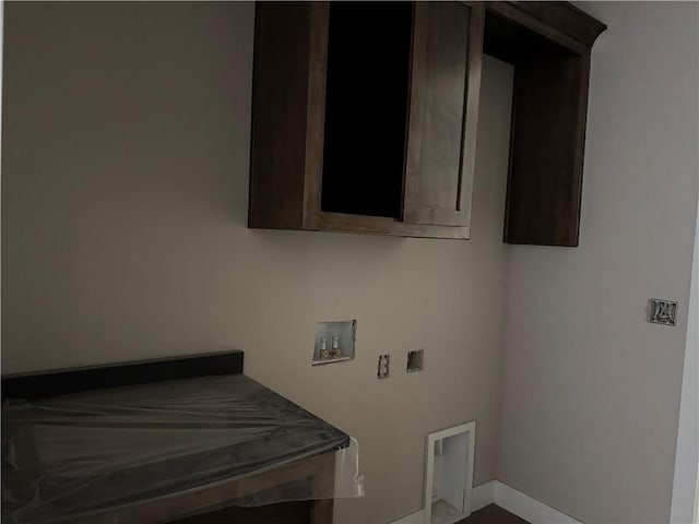 washroom featuring washer hookup, laundry area, and baseboards