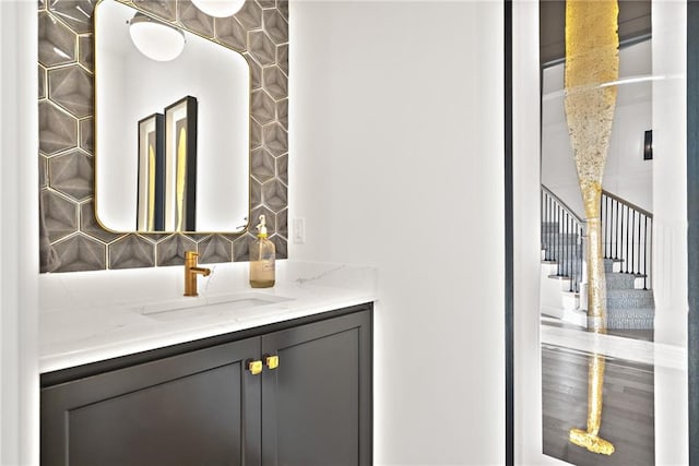 bathroom featuring decorative backsplash and vanity