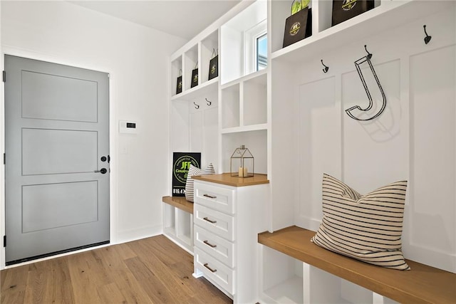 mudroom with light hardwood / wood-style flooring