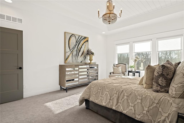 carpeted bedroom with an inviting chandelier and wood ceiling