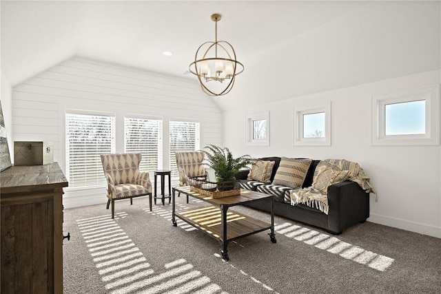 carpeted living room with vaulted ceiling, a chandelier, and a healthy amount of sunlight