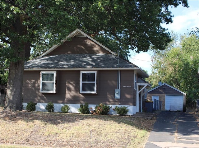 view of front facade with an outbuilding and a garage