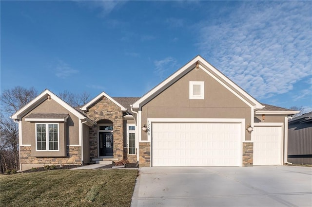 view of front of home with a garage and a front yard