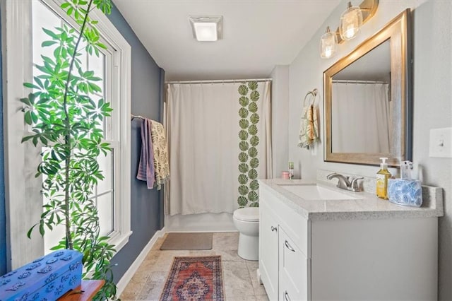 bathroom featuring a shower with curtain, vanity, tile patterned flooring, and toilet