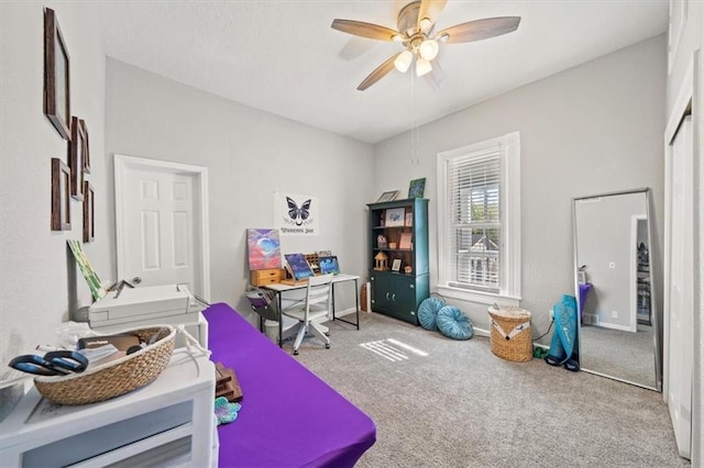 recreation room featuring ceiling fan and carpet floors