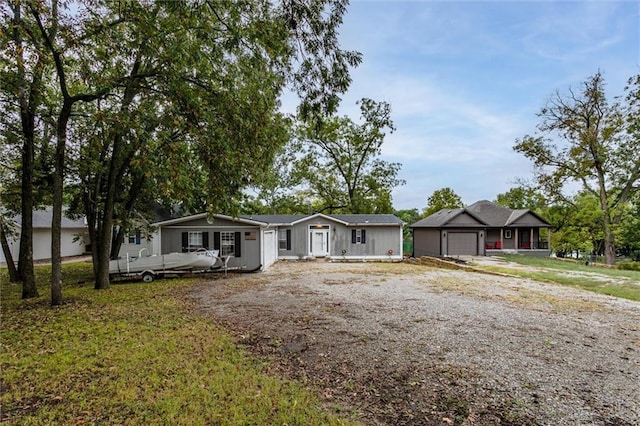 view of front of property with driveway and a garage