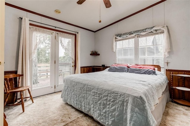 bedroom with light carpet, access to exterior, multiple windows, and ornamental molding